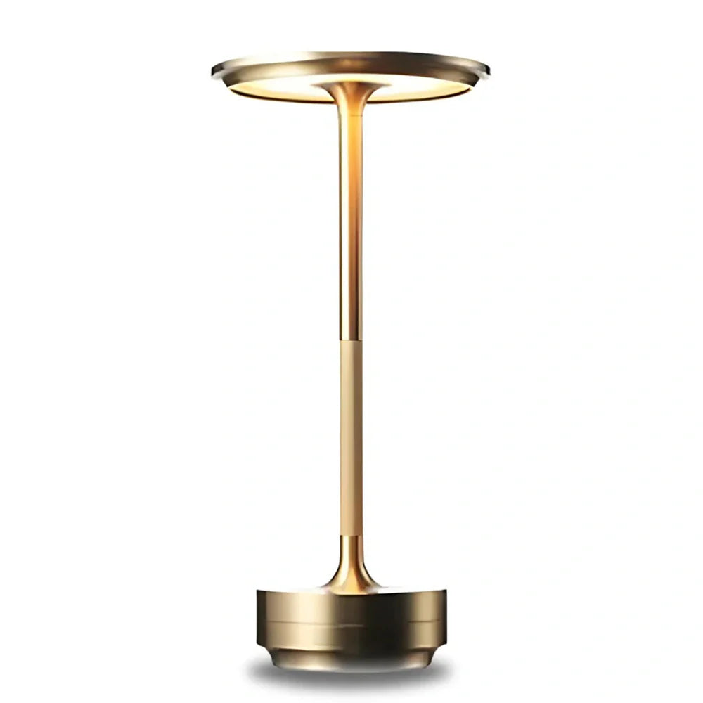 Gold-colored outdoor light fixture on a white background
